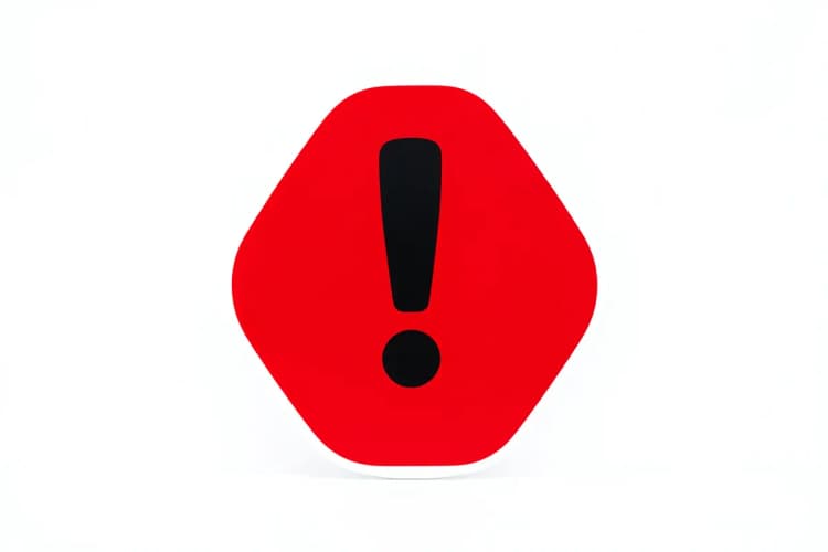 Um sinal de alerta vermelho com um ponto de exclamação preto no centro, em um fundo branco.